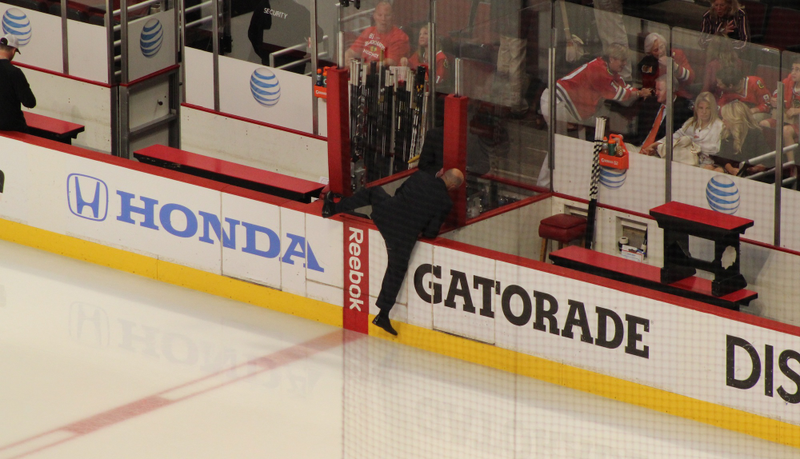 Illustration for article titled I Can't Stop Looking At These Pics Of Pierre McGuire Scaling The Boards